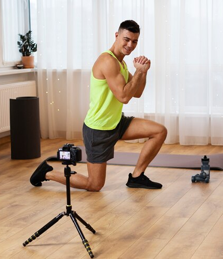 Man doing sit-ups with a tablet displaying workout stats